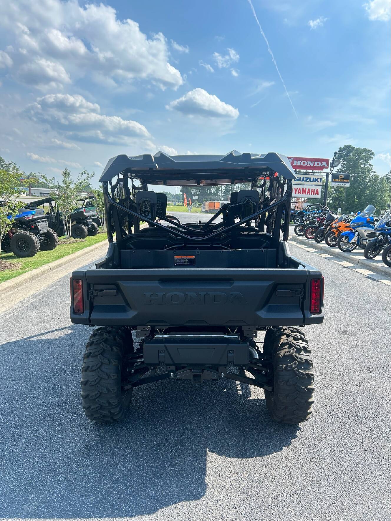A photo of this 2025 Honda Pioneer 1000-6 Deluxe Crew