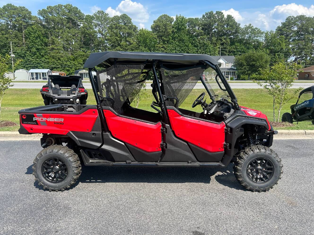 A photo of this 2025 Honda Pioneer 1000-6 Deluxe Crew