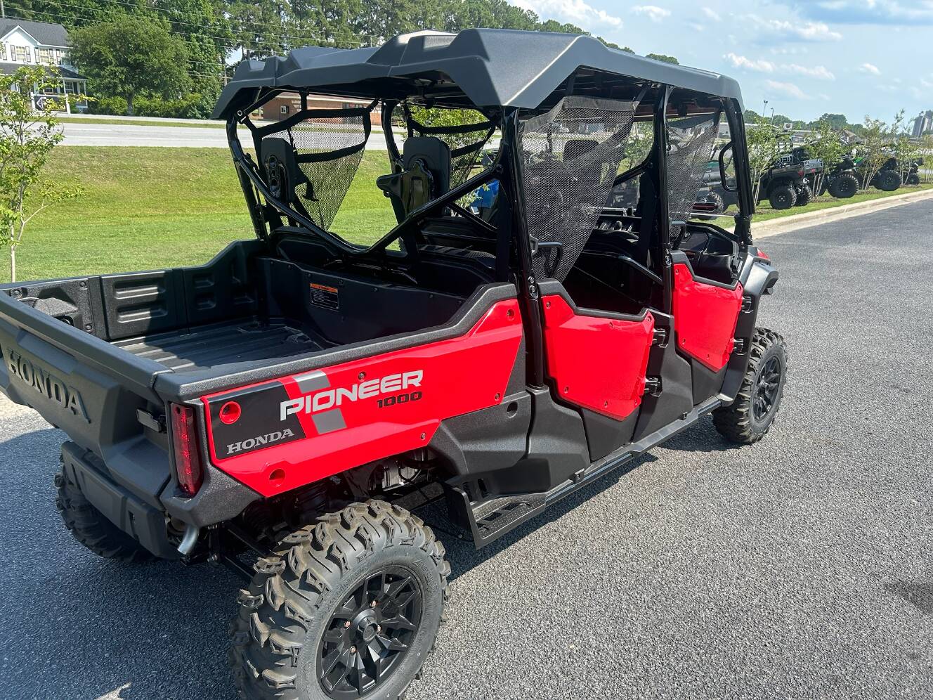A photo of this 2025 Honda Pioneer 1000-6 Deluxe Crew