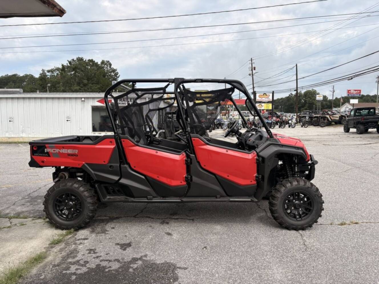 A photo of this 2025 Honda® Pioneer 1000-6 Deluxe Crew