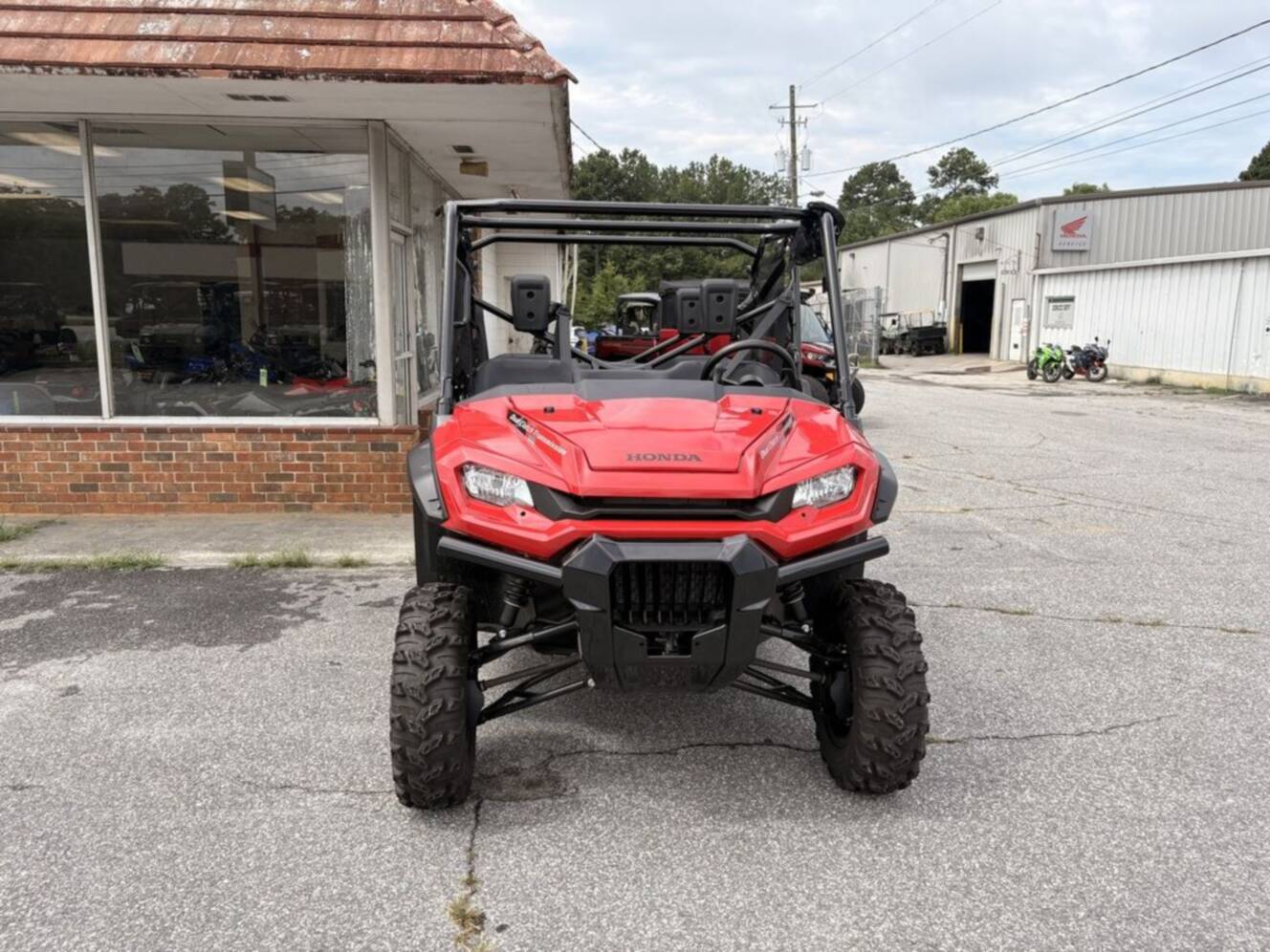 A photo of this 2025 Honda® Pioneer 1000-6 Deluxe Crew