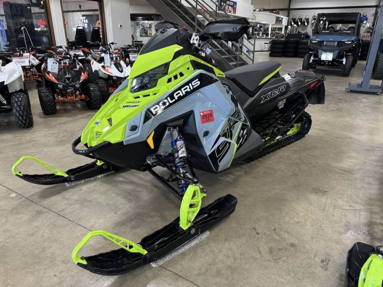 A photo of this 2025 Polaris® Patriot 9R Indy XCR 136 Storm Gray / Neon