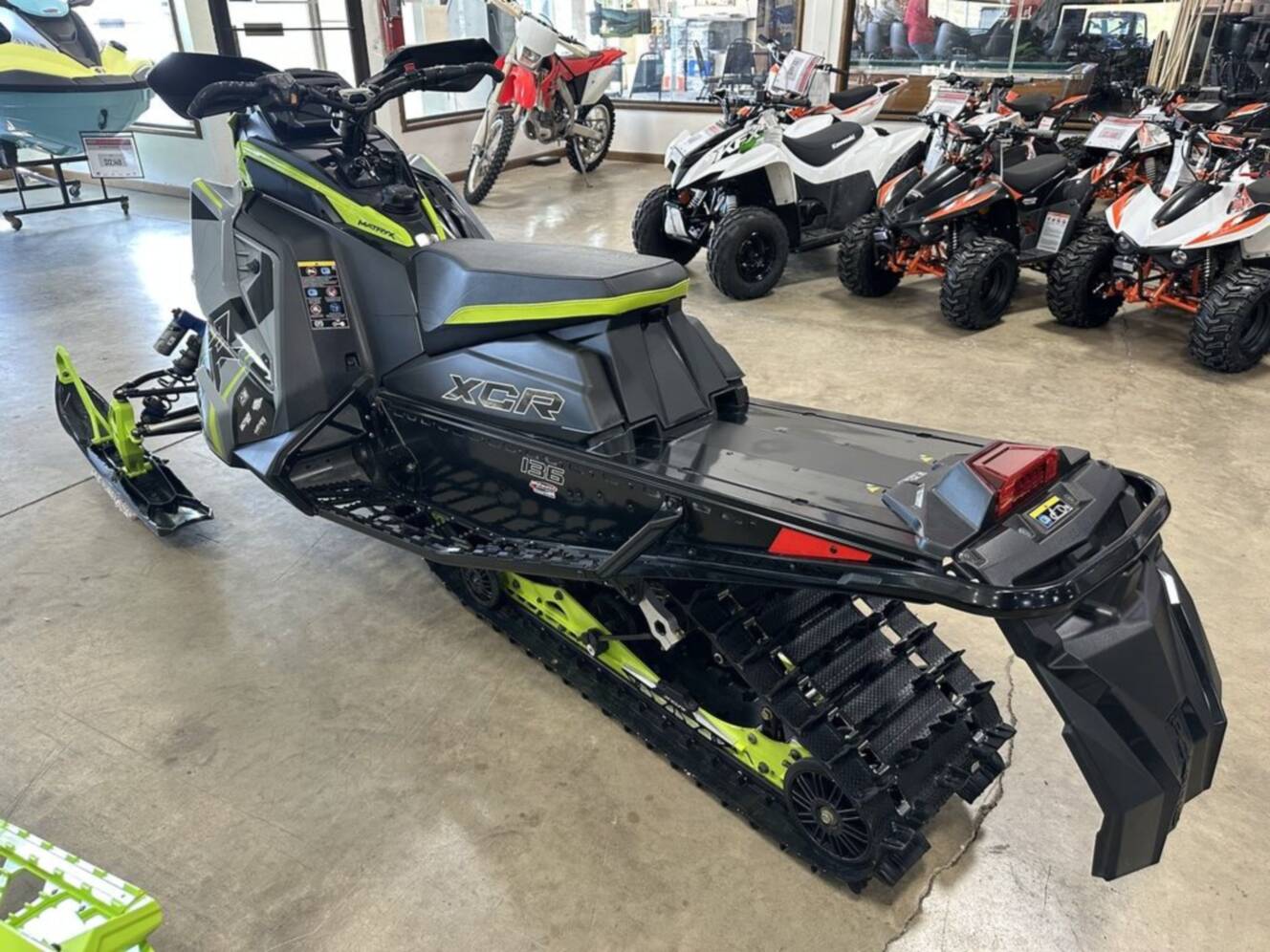 A photo of this 2025 Polaris® Patriot 9R Indy XCR 136 Storm Gray / Neon
