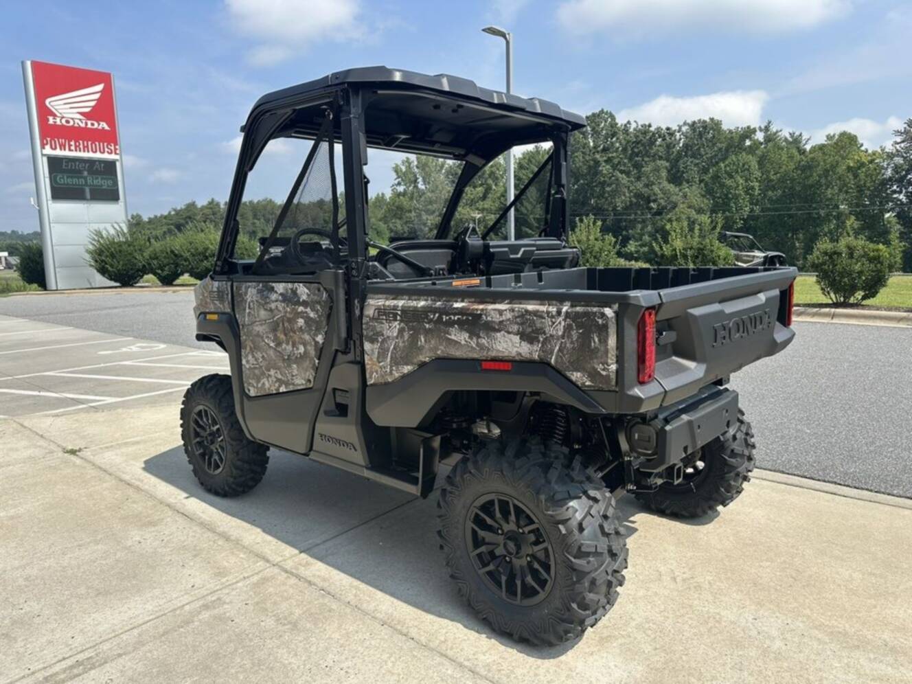 A photo of this 2026 Honda® Pioneer 1000 Deluxe TrueTimber atera camo