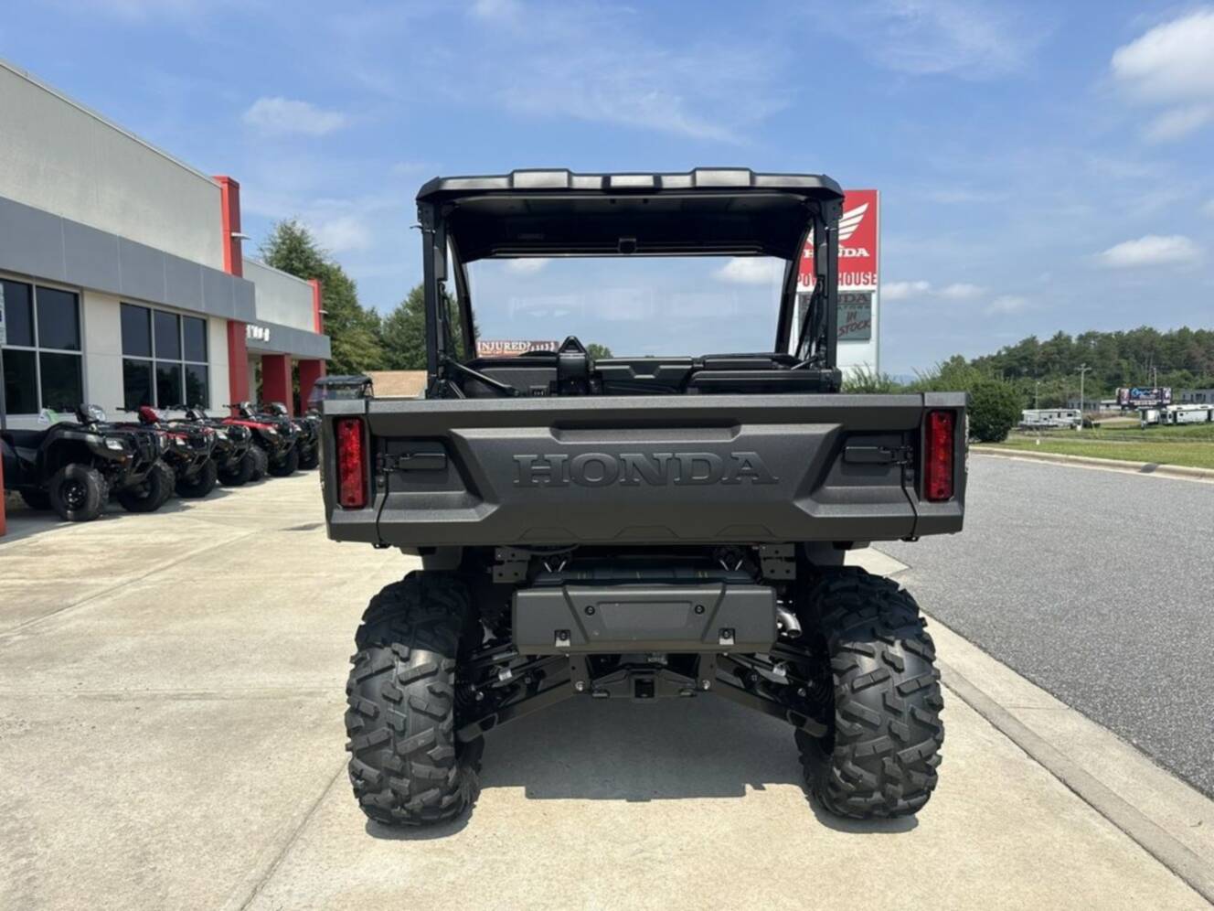A photo of this 2026 Honda® Pioneer 1000 Deluxe TrueTimber atera camo