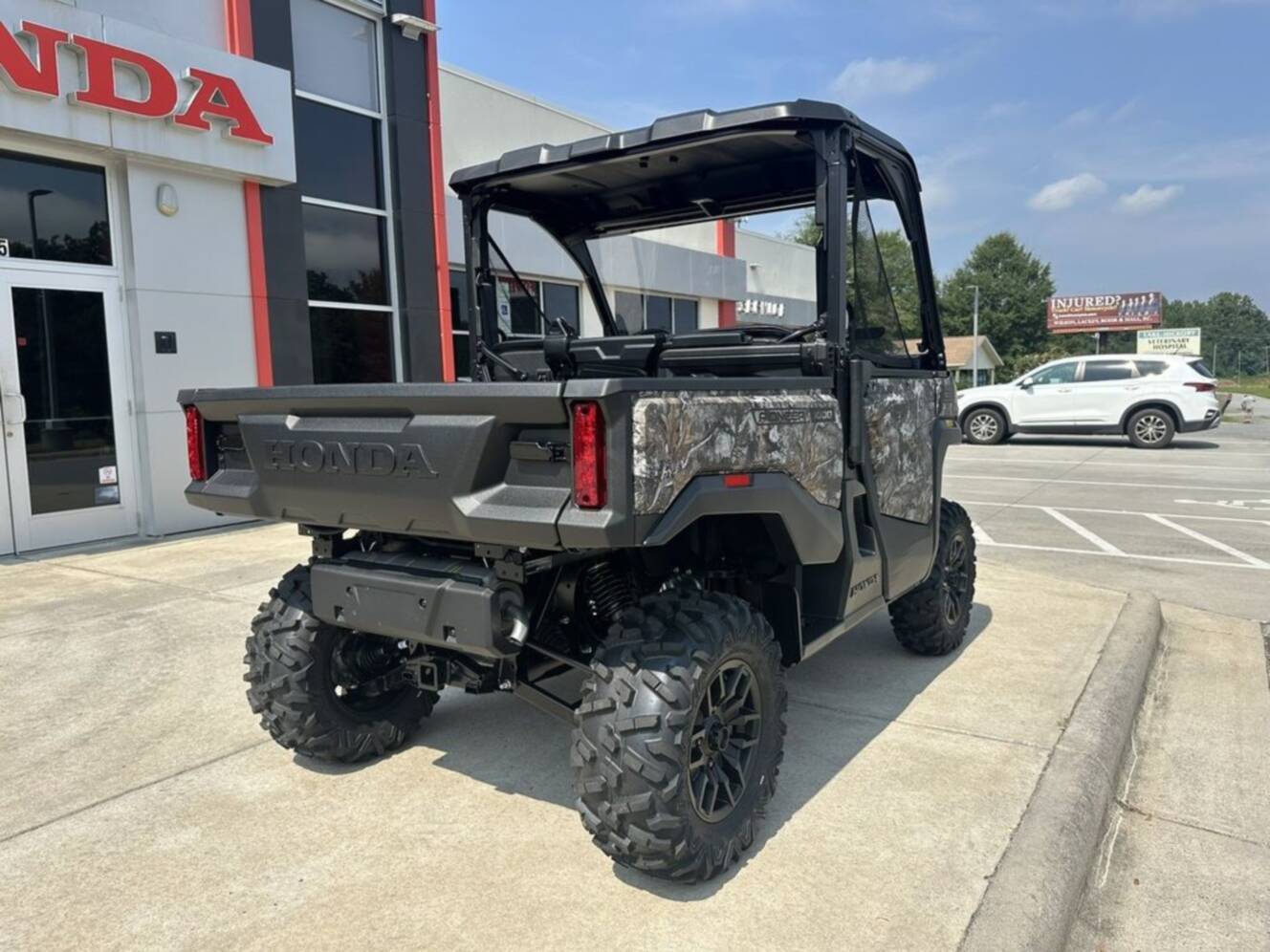 A photo of this 2026 Honda® Pioneer 1000 Deluxe TrueTimber atera camo