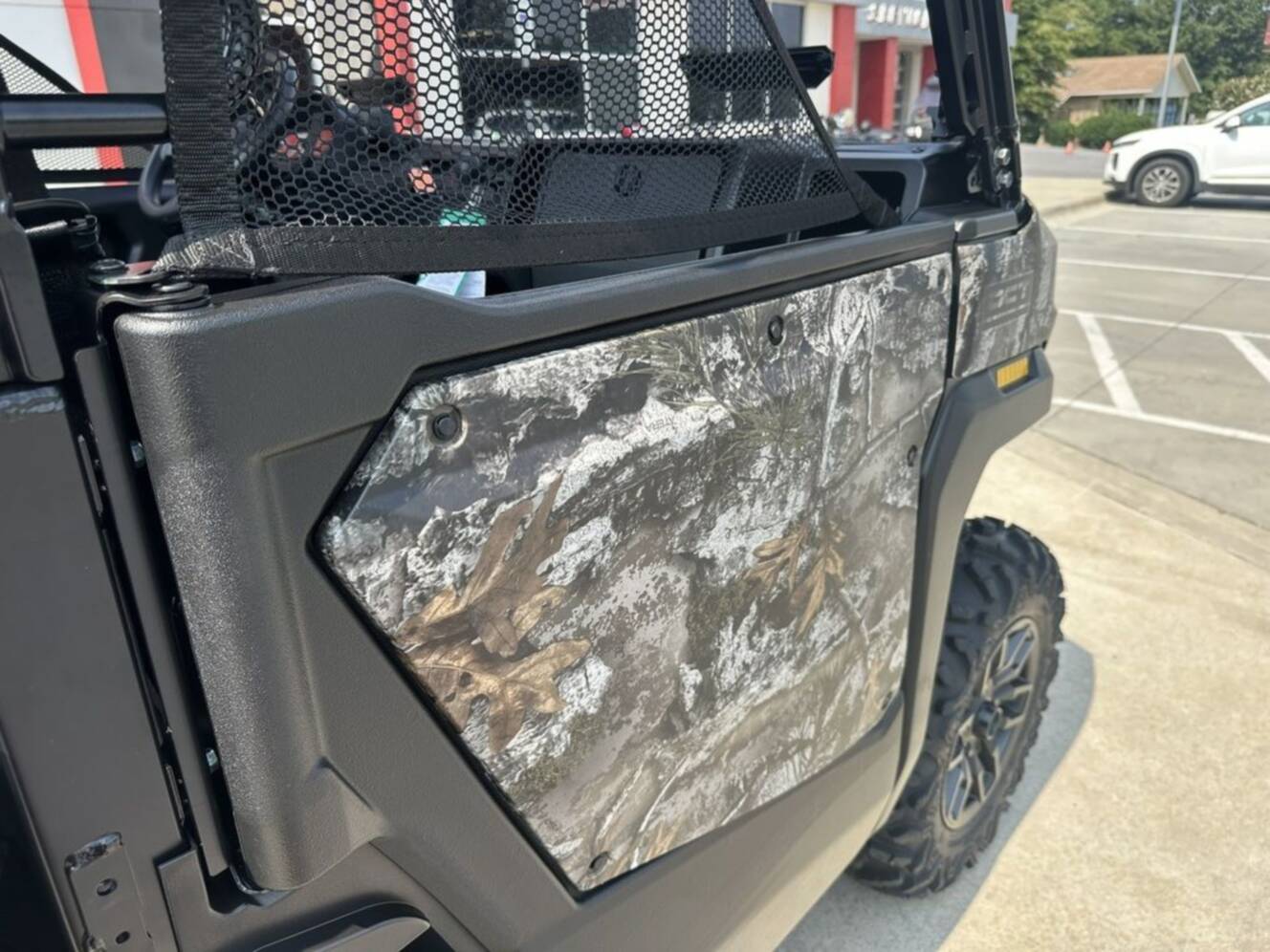 A photo of this 2026 Honda® Pioneer 1000 Deluxe TrueTimber atera camo