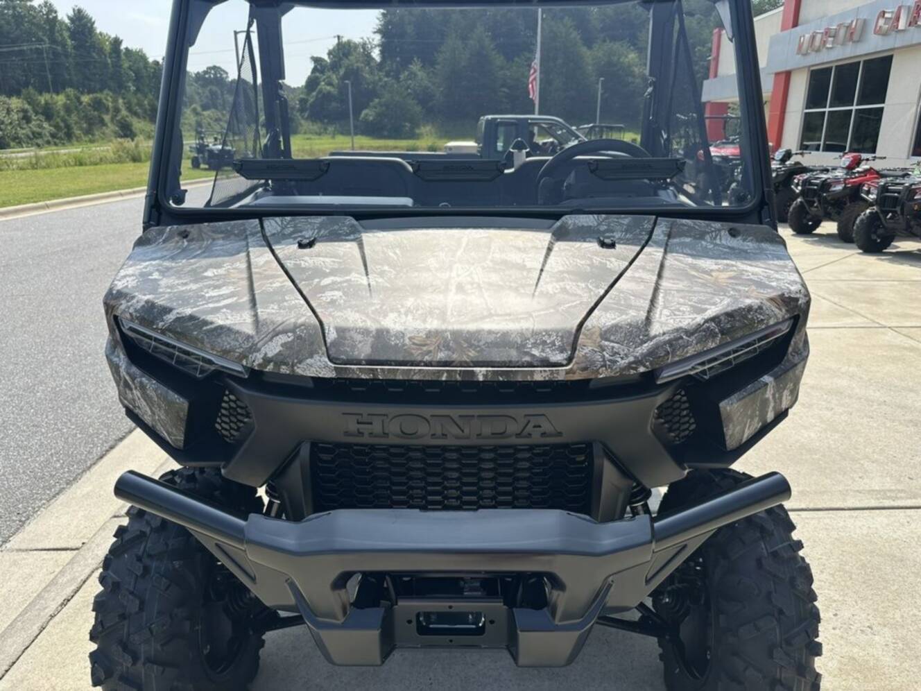 A photo of this 2026 Honda® Pioneer 1000 Deluxe TrueTimber atera camo