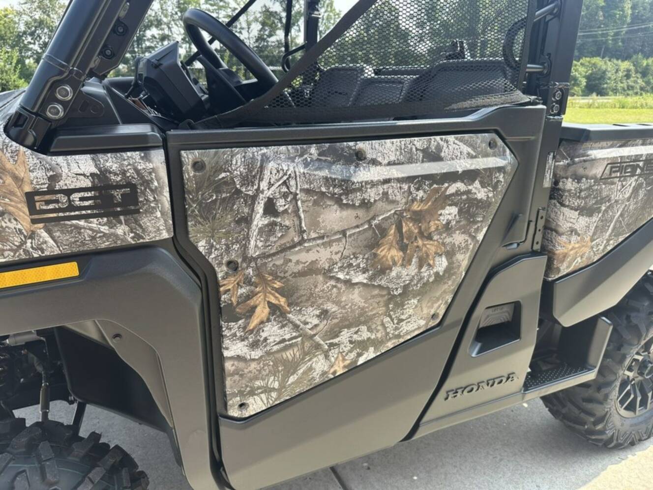 A photo of this 2026 Honda® Pioneer 1000 Deluxe TrueTimber atera camo