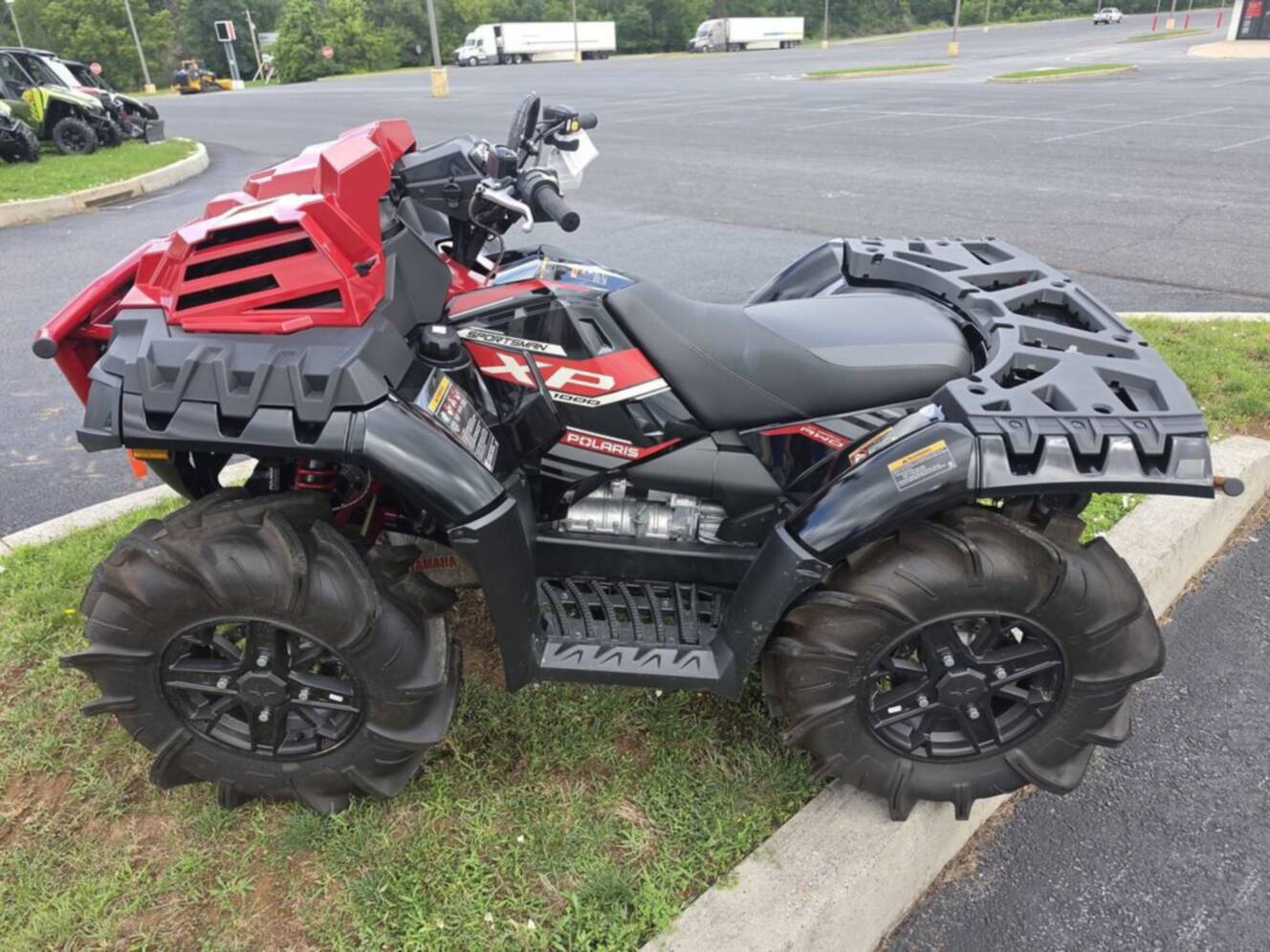 A photo of this 2025 Polaris Sportsman XP 1000 Mud Edition