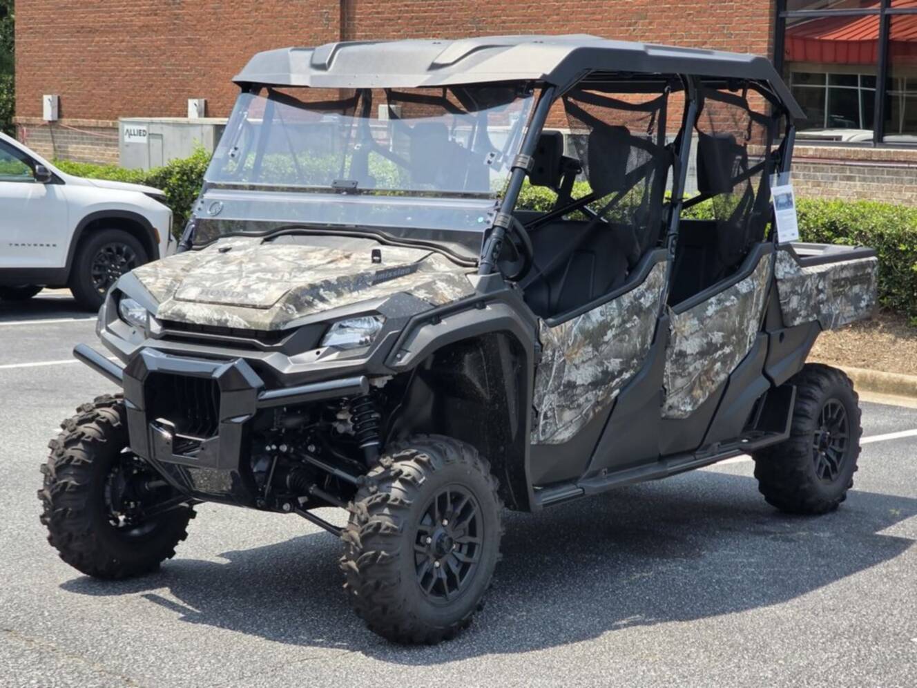 A photo of this 2025 Honda® Pioneer 1000-6 Deluxe Crew TrueTimber Atera Camo
