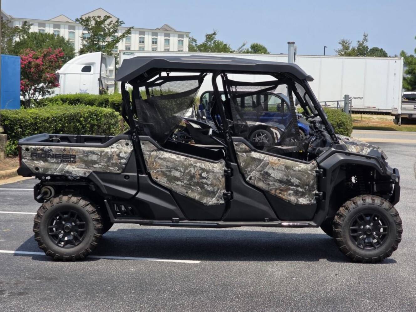 A photo of this 2025 Honda® Pioneer 1000-6 Deluxe Crew TrueTimber Atera Camo