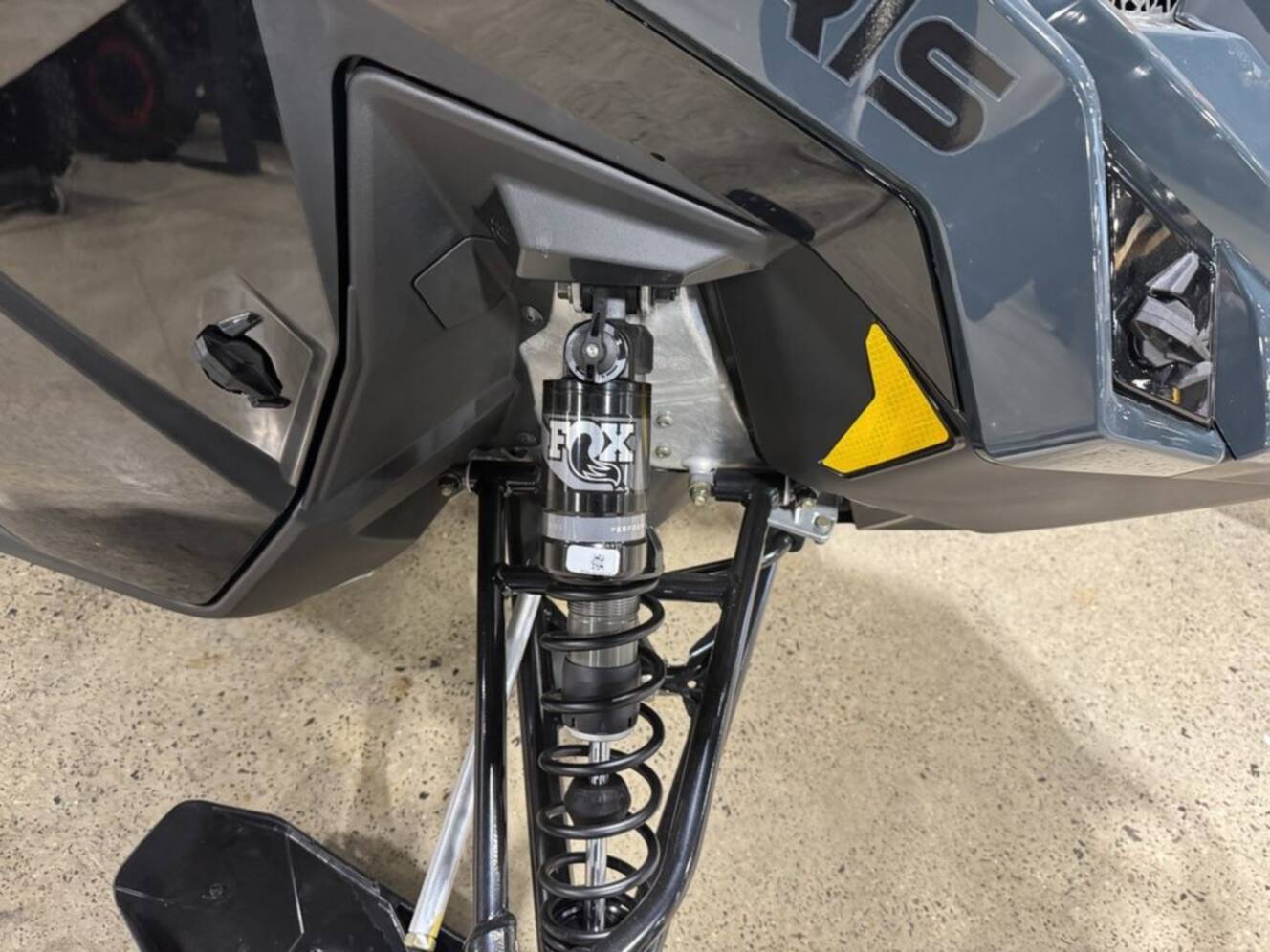 A photo of this 2026 Polaris® 850 PRO RMK 155 Gloss Black / Blue Dusk