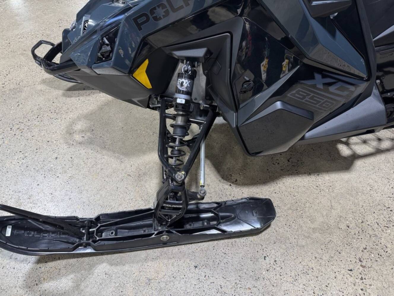 A photo of this 2026 Polaris® 850 PRO RMK 155 Gloss Black / Blue Dusk