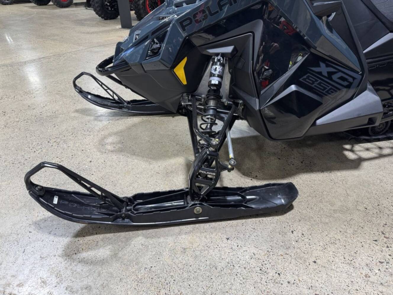 A photo of this 2026 Polaris® 850 PRO RMK 155 Gloss Black / Blue Dusk