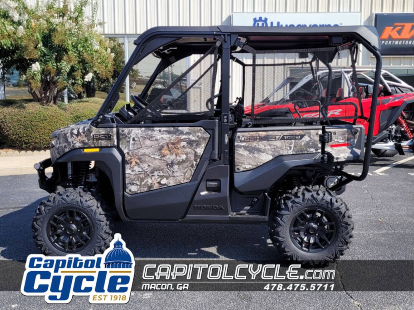 A photo of this 2026 Honda® Pioneer 1000-5 Deluxe TrueTimber Atera Camo
