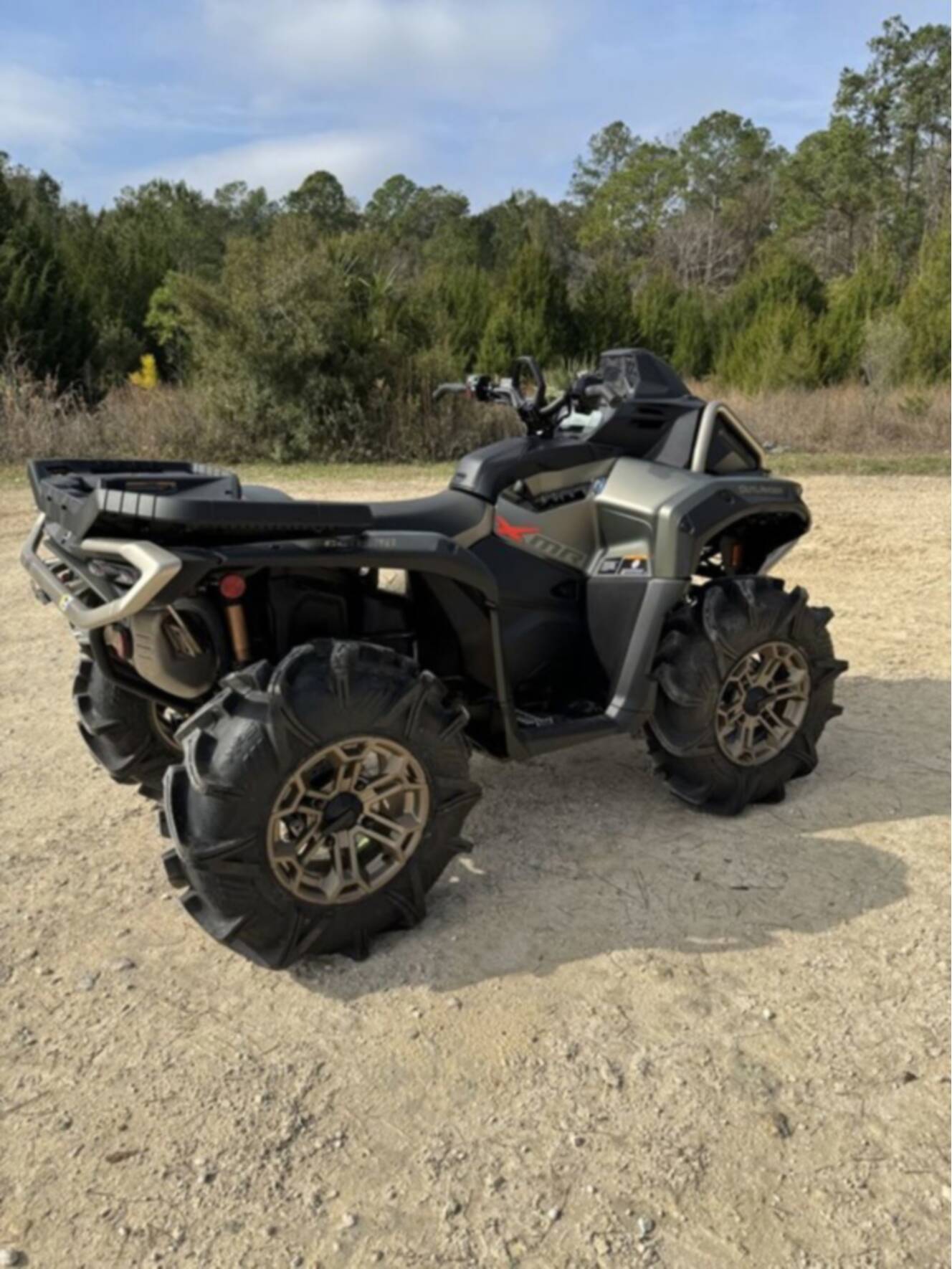A photo of this 2026 Can-Am Outlander X Mr 1000R Loft Green Satin