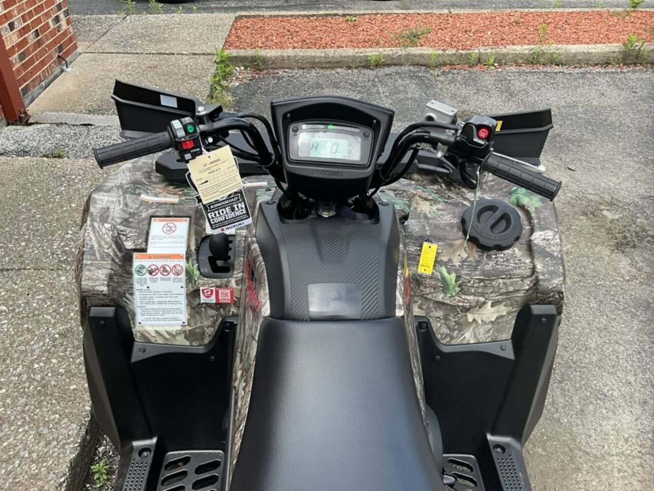 A photo of this 2026 Suzuki KingQuad 500AXi Power Steering SE Camo