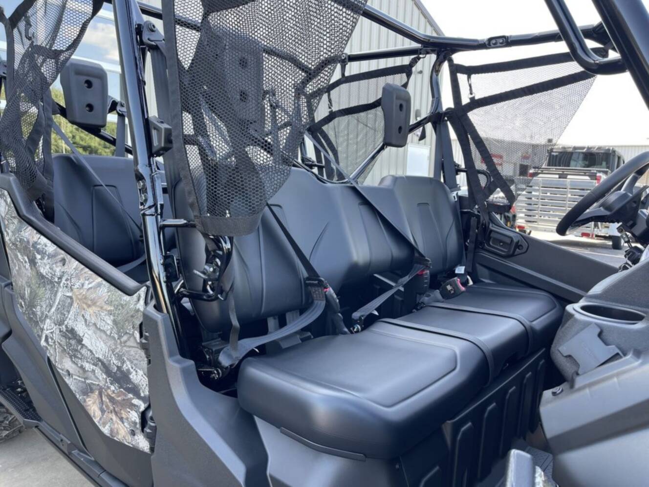 A photo of this 2025 Honda® Pioneer 1000-6 Deluxe Crew TrueTimber Atera Camo