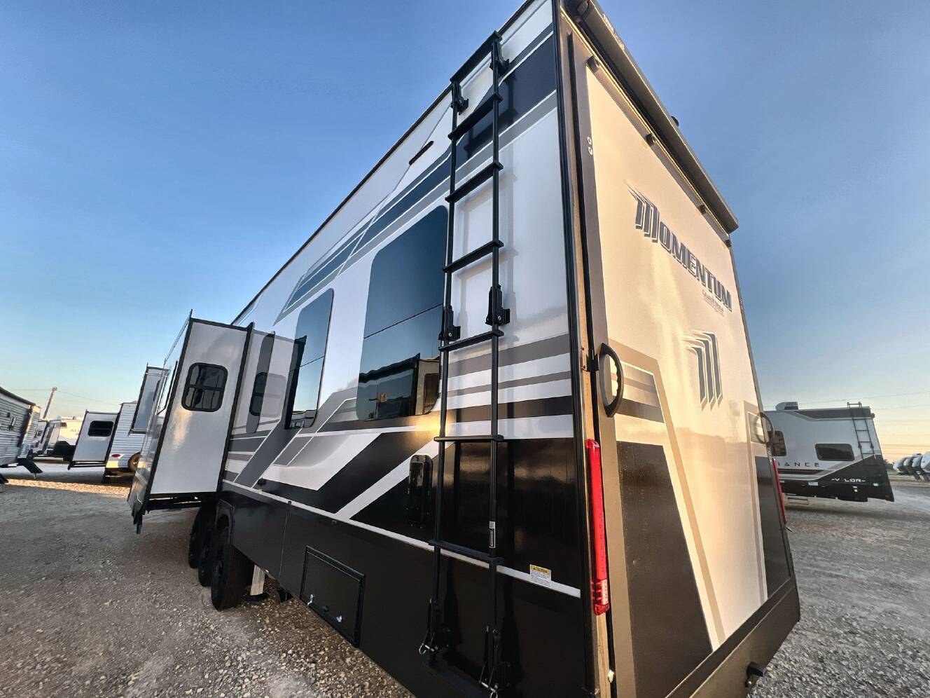A photo of this 2027 Grand Design MOMENTUM 395MT