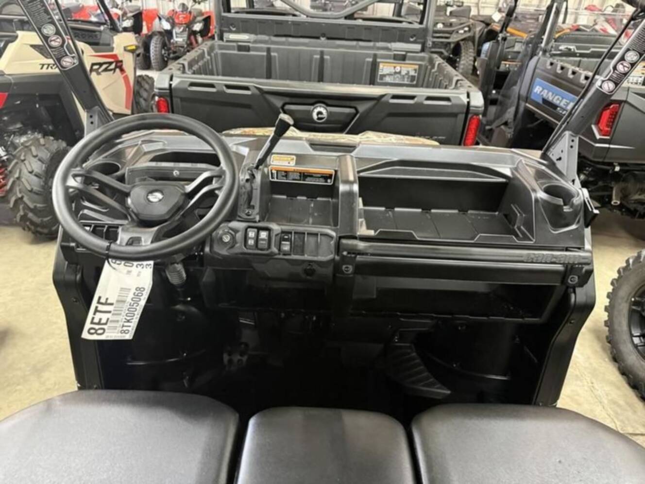 A photo of this 2026 Can-Am Defender DPS HD9 Dark Wildland Camo