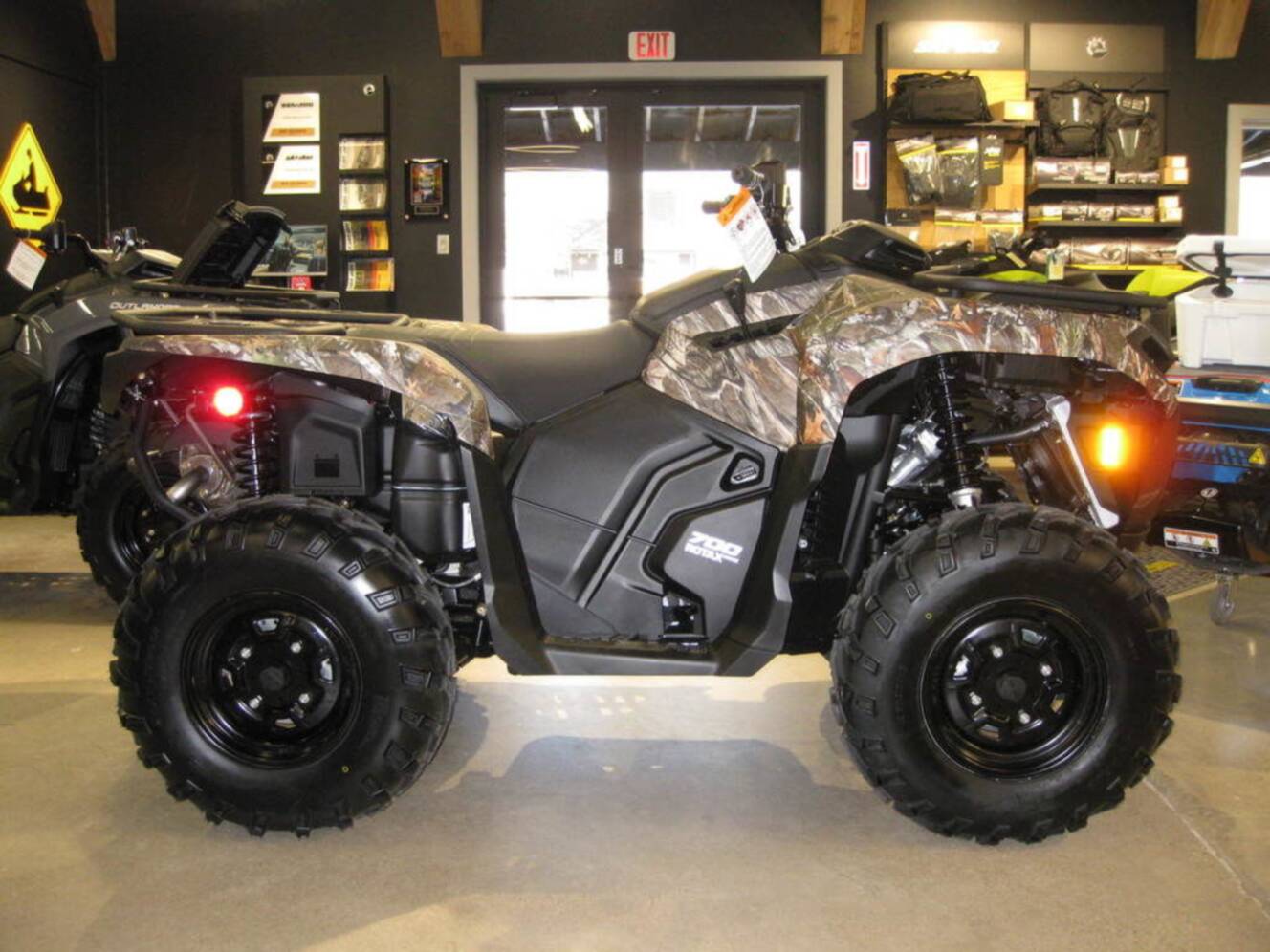 A photo of this 2026 Can-Am Outlander DPS 700 Wildland Camo