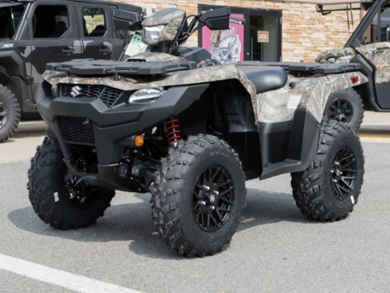 A photo of this 2025 Suzuki KingQuad 500AXi Power Steering SE Camo