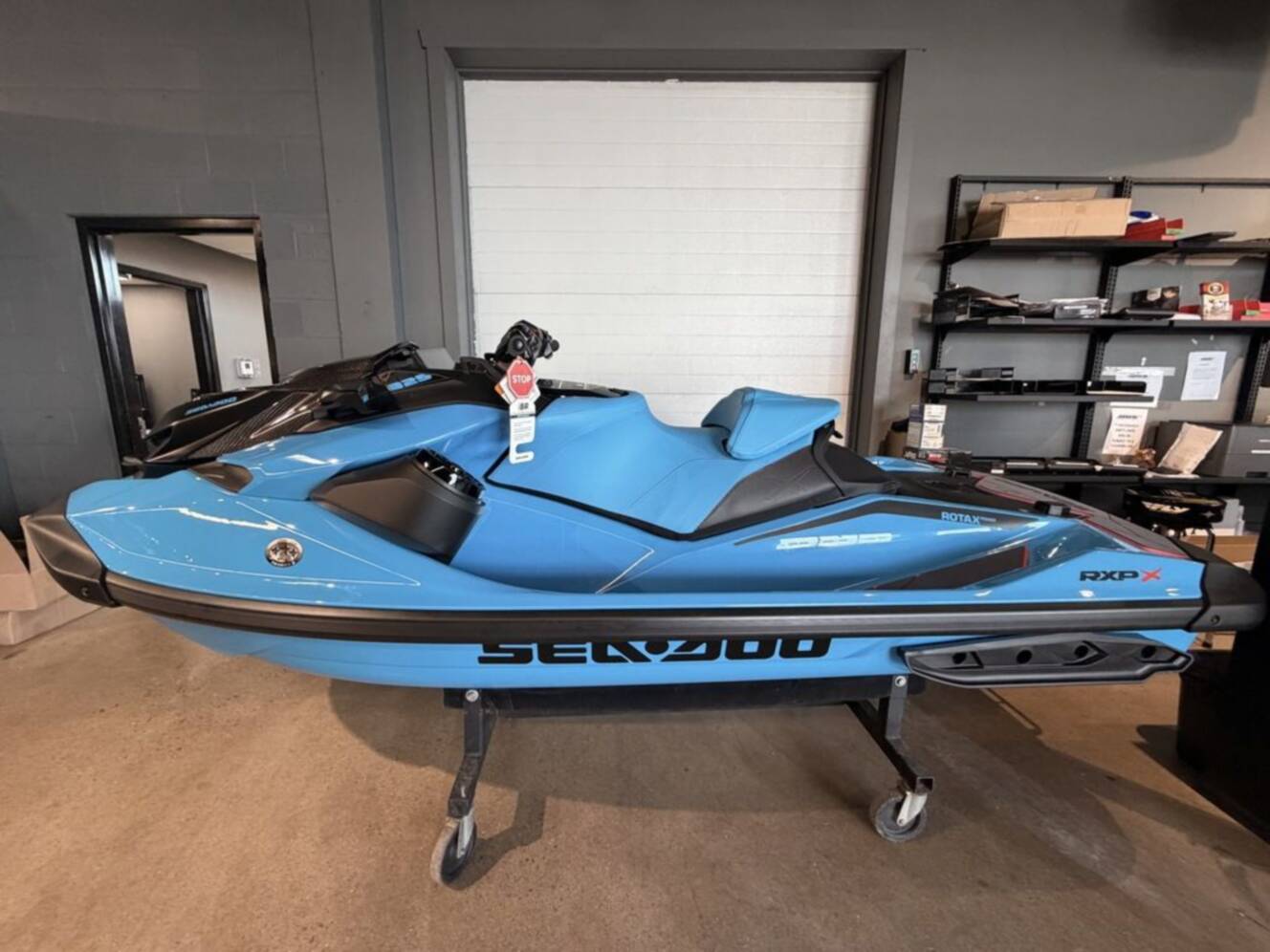 A photo of this 2026 Sea-Doo RXP-X 325 Tech, BRP Premium A, iBR Gulfstream Blue P