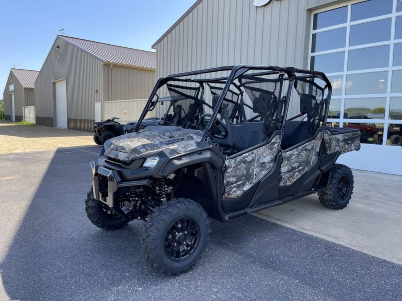 A photo of this 2025 Honda® Pioneer 1000-6 Deluxe Crew TrueTimber Atera Camo