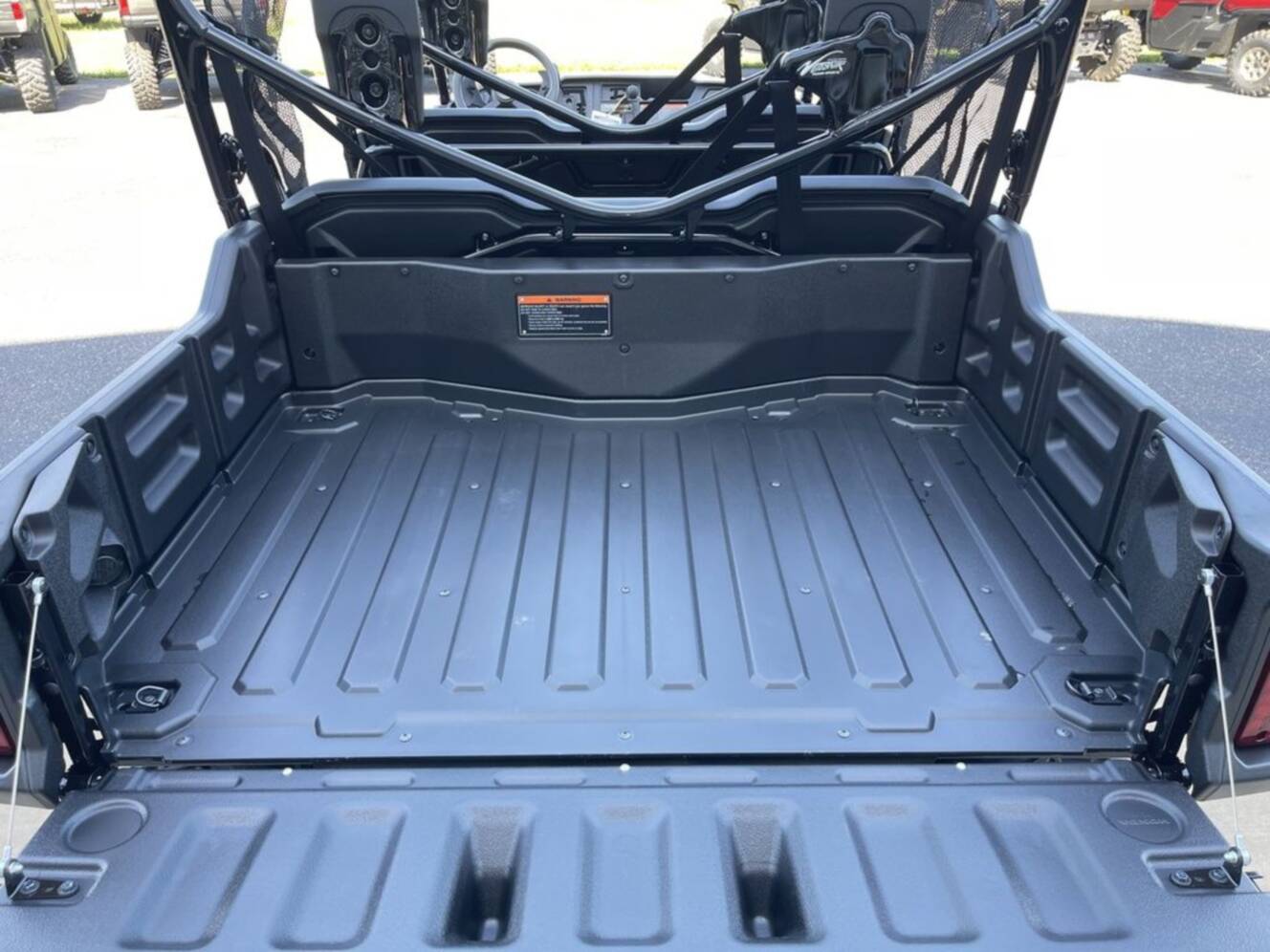 A photo of this 2025 Honda® Pioneer 1000-6 Deluxe Crew TrueTimber Atera Camo