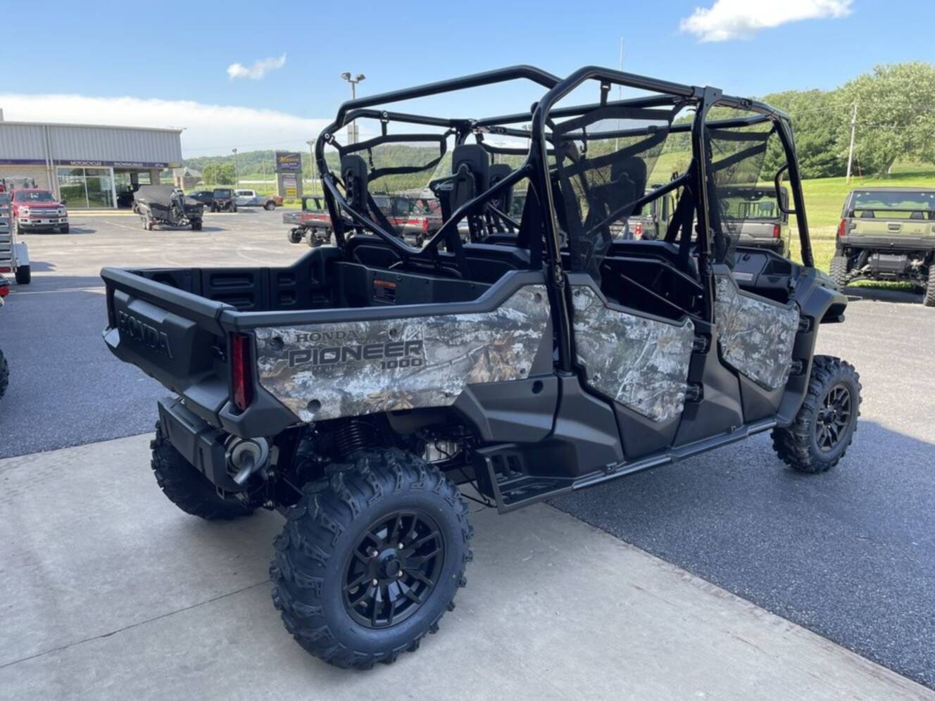 A photo of this 2025 Honda® Pioneer 1000-6 Deluxe Crew TrueTimber Atera Camo