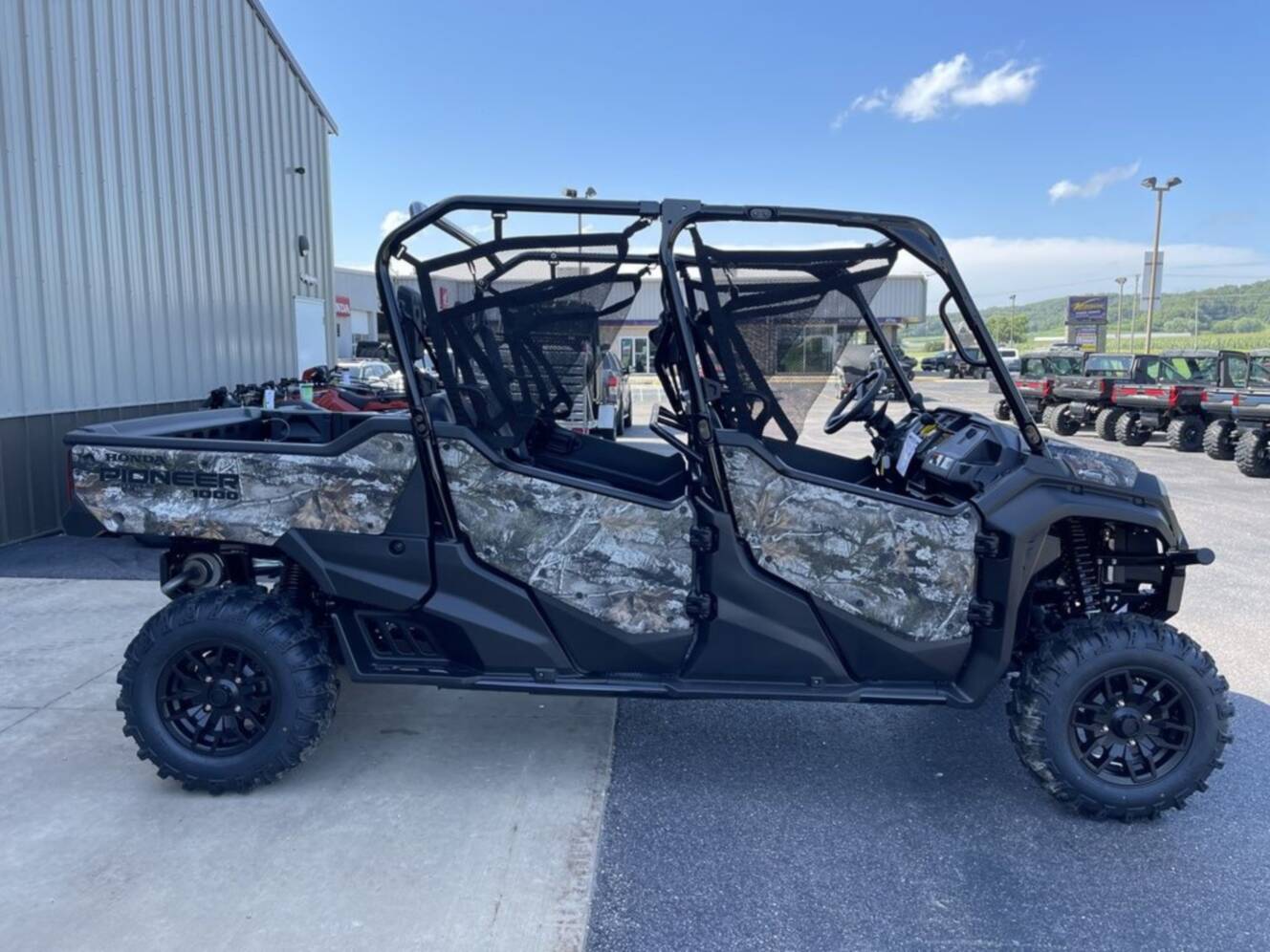 A photo of this 2025 Honda® Pioneer 1000-6 Deluxe Crew TrueTimber Atera Camo