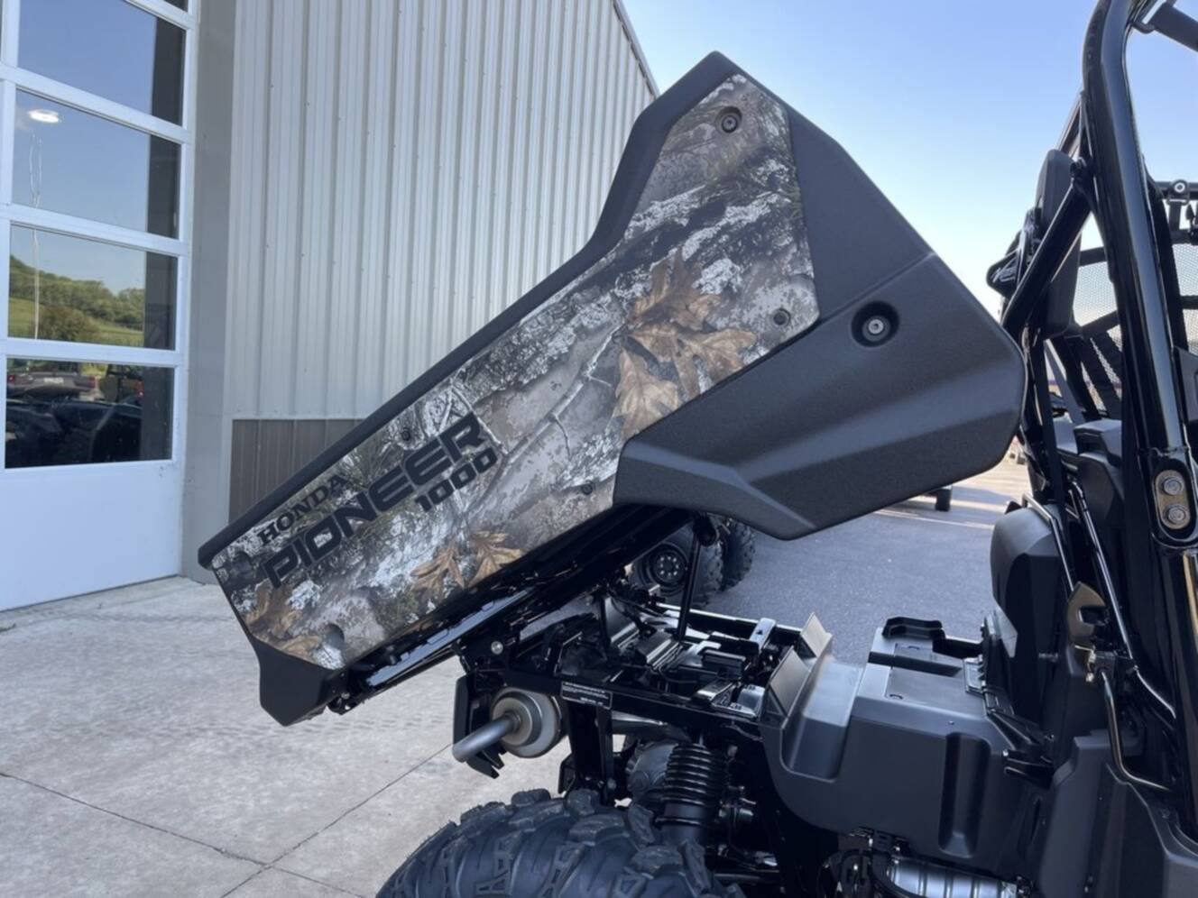 A photo of this 2025 Honda® Pioneer 1000-6 Deluxe Crew TrueTimber Atera Camo