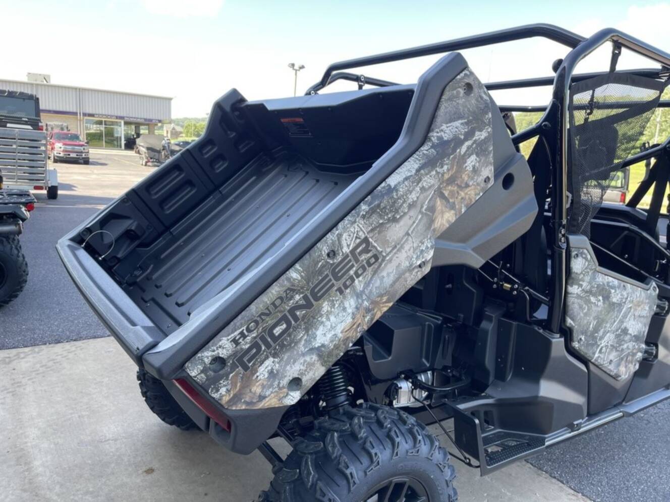 A photo of this 2025 Honda® Pioneer 1000-6 Deluxe Crew TrueTimber Atera Camo
