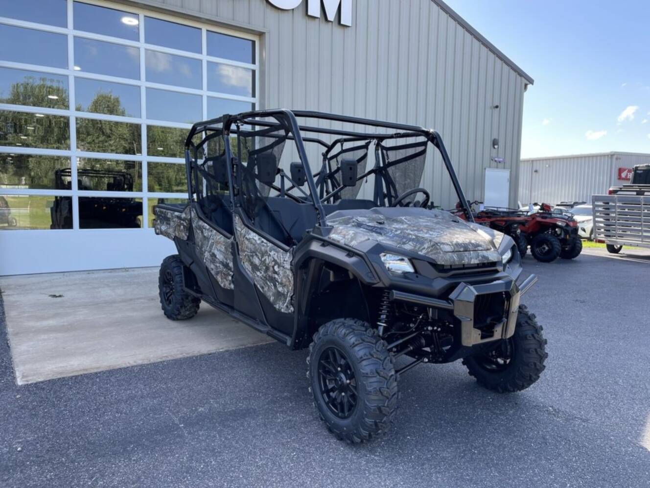 A photo of this 2025 Honda® Pioneer 1000-6 Deluxe Crew TrueTimber Atera Camo