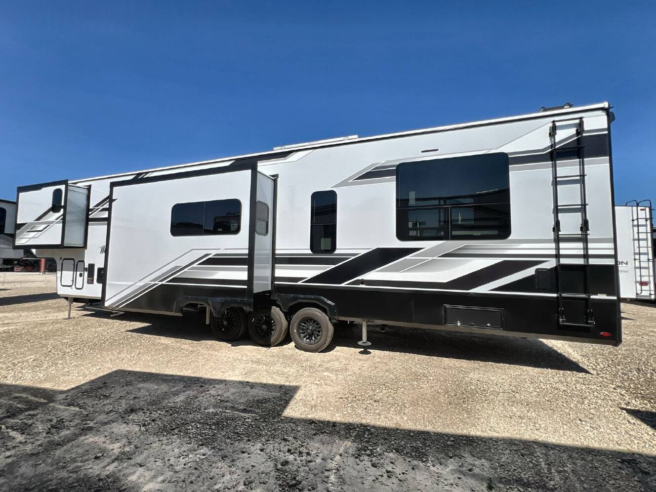 A photo of this 2026 Grand Design MOMENTUM 395MS