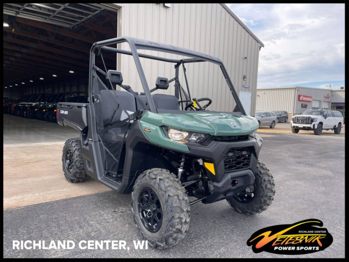 A photo of this 2026 Can-Am Defender DPS HD7 Compass Green