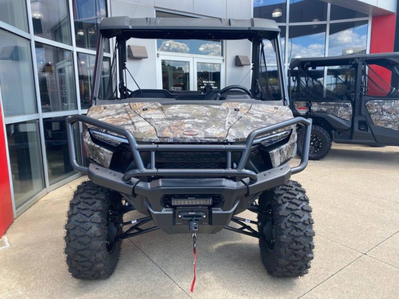 A photo of this 2026 Honda® Pioneer 1000 Deluxe TrueTimber atera camo