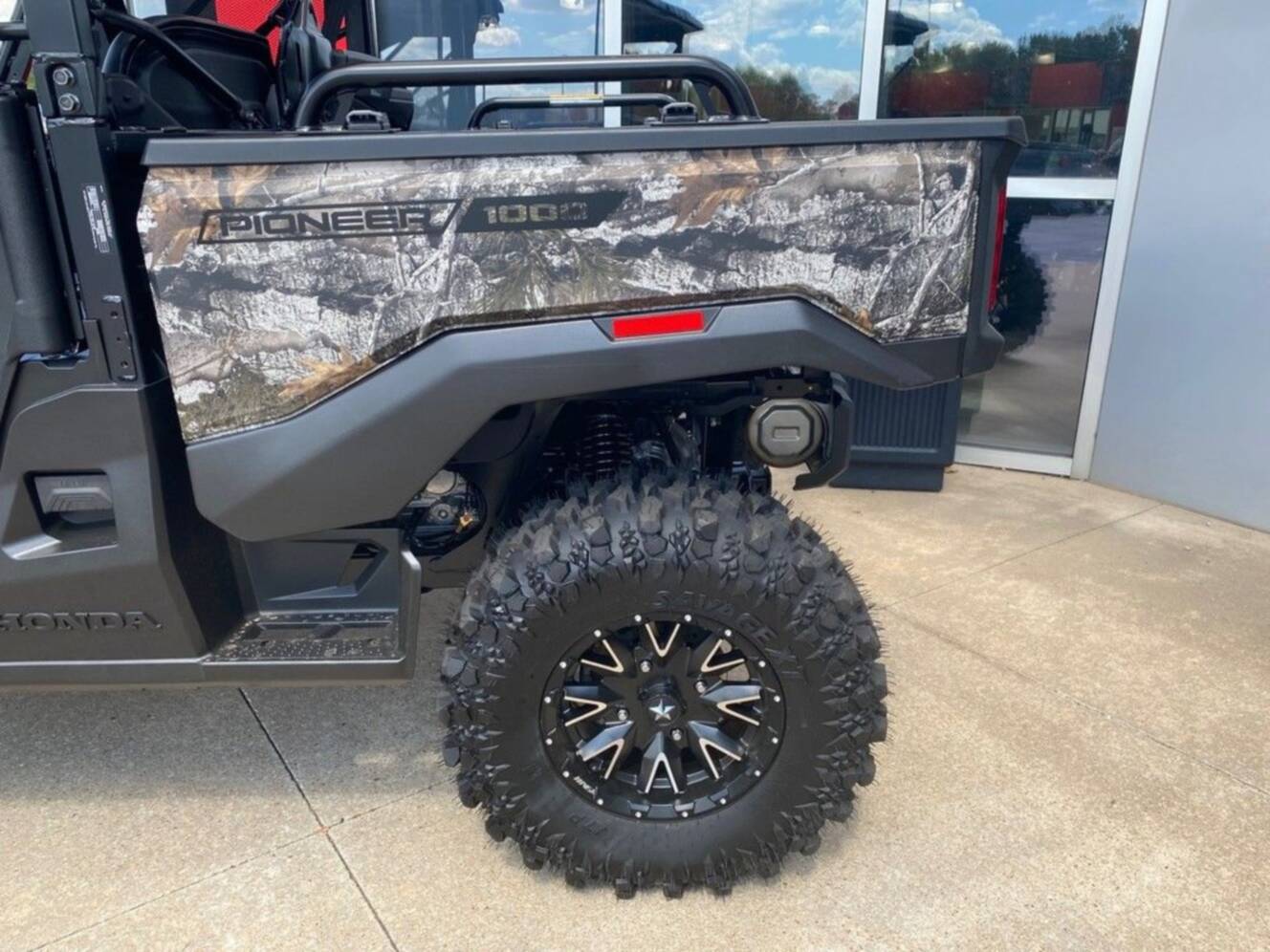 A photo of this 2026 Honda® Pioneer 1000 Deluxe TrueTimber atera camo
