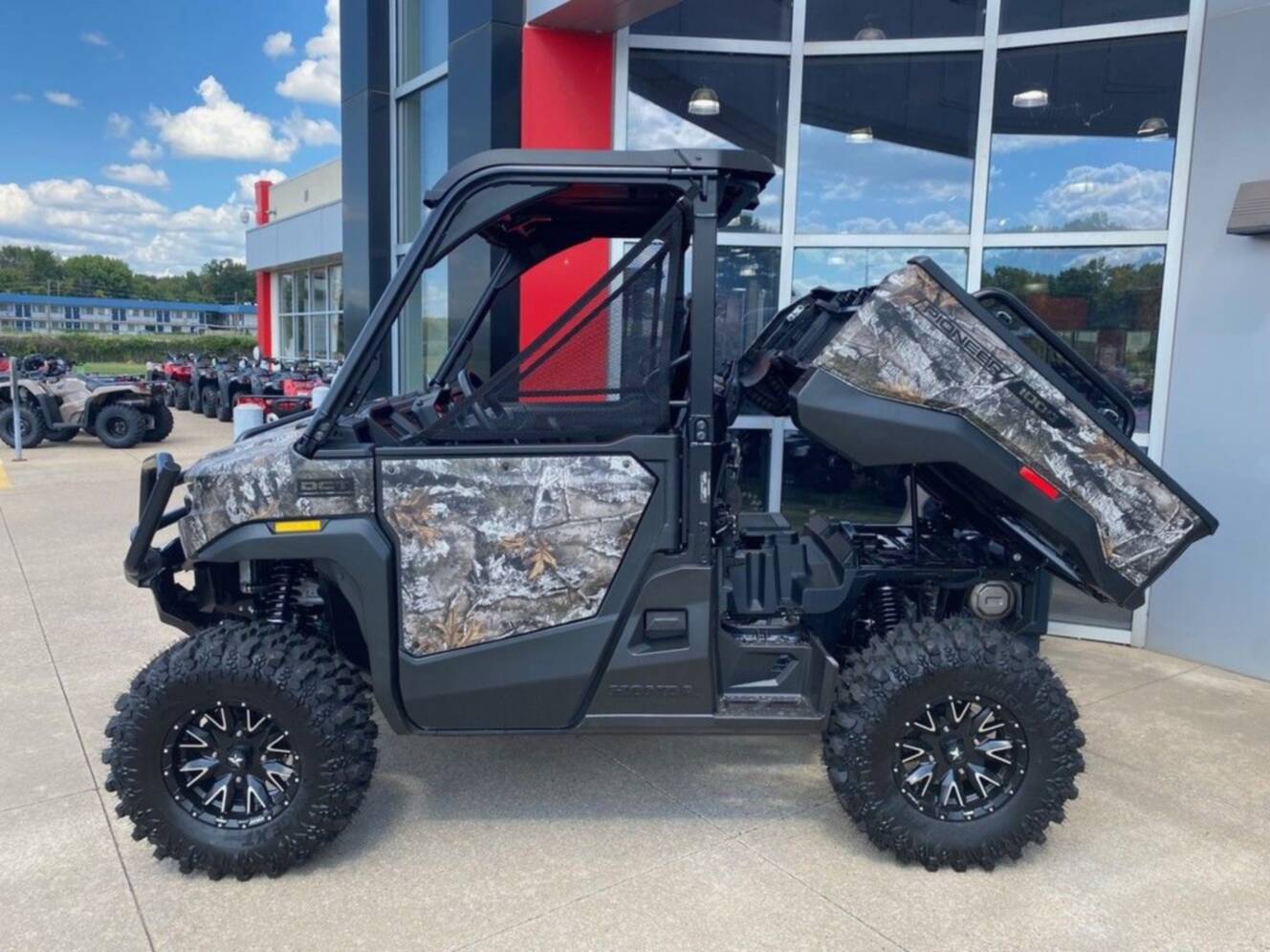 A photo of this 2026 Honda® Pioneer 1000 Deluxe TrueTimber atera camo