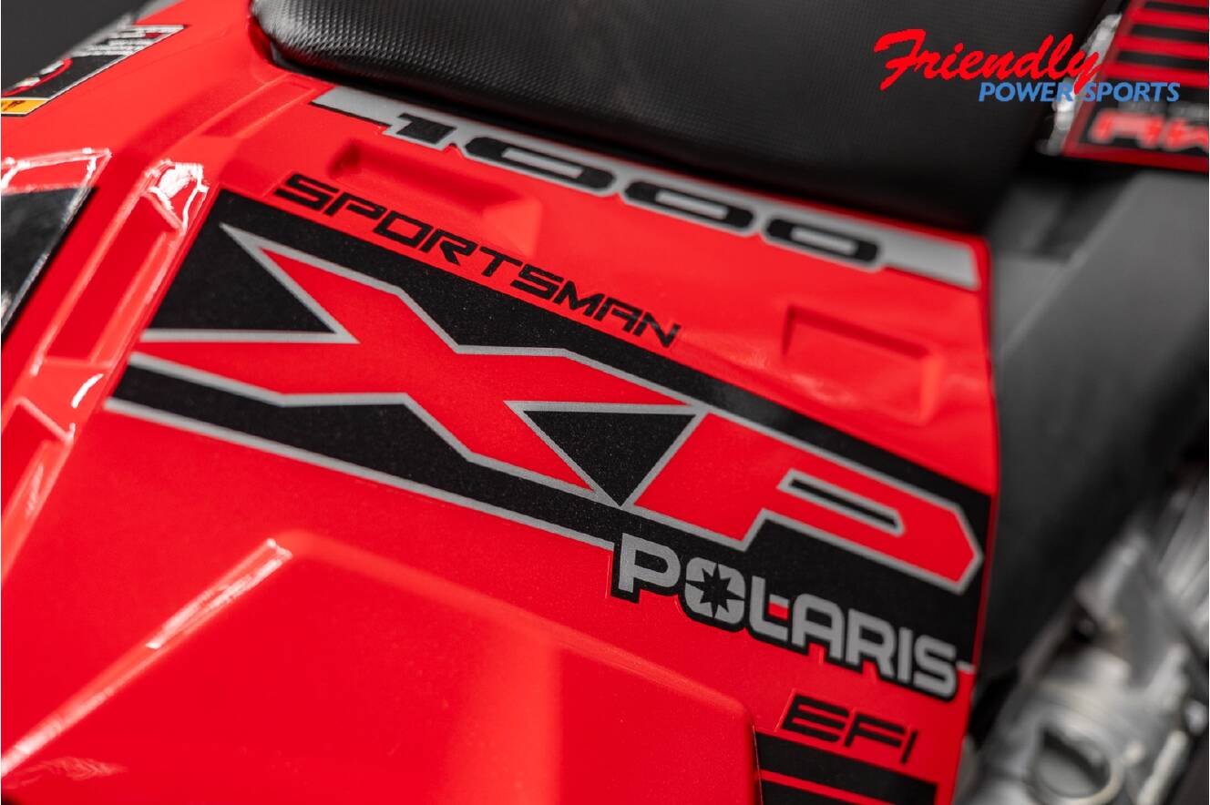 A photo of this 2026 Polaris SPORTSMAN XP 1000 MUD ED INDY RED PEARL Mud Edition