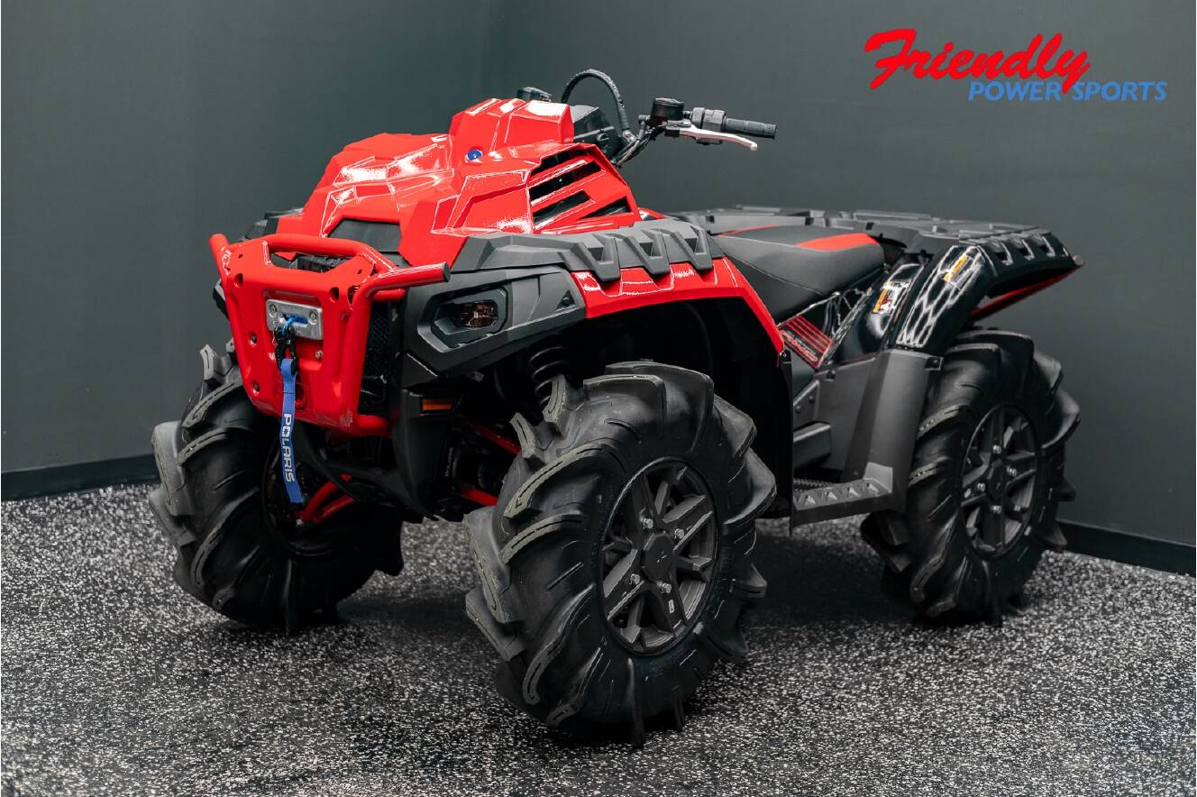 A photo of this 2026 Polaris SPORTSMAN XP 1000 MUD ED INDY RED PEARL Mud Edition
