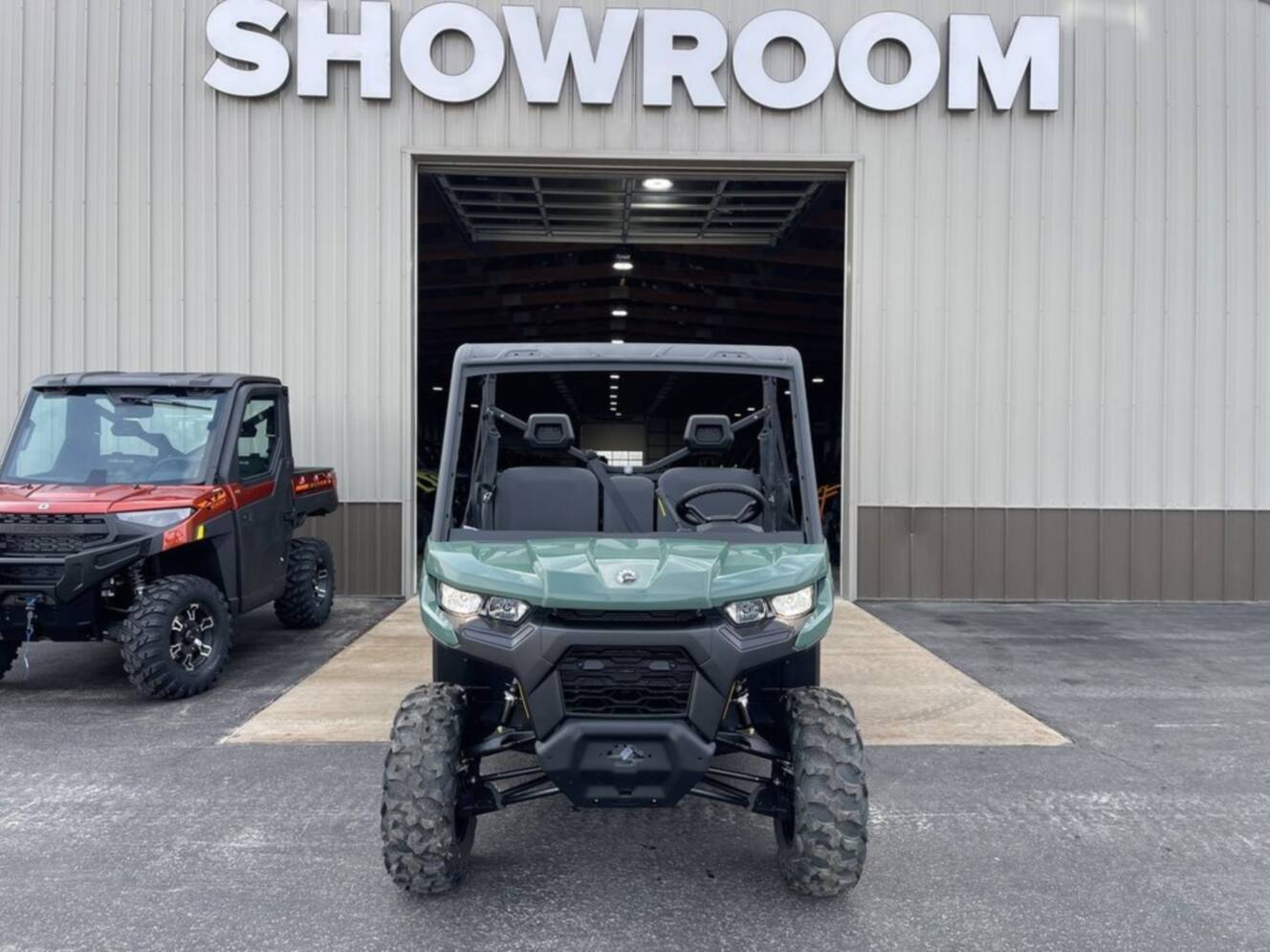 A photo of this 2026 Can-Am Defender DPS HD7 Compass Green