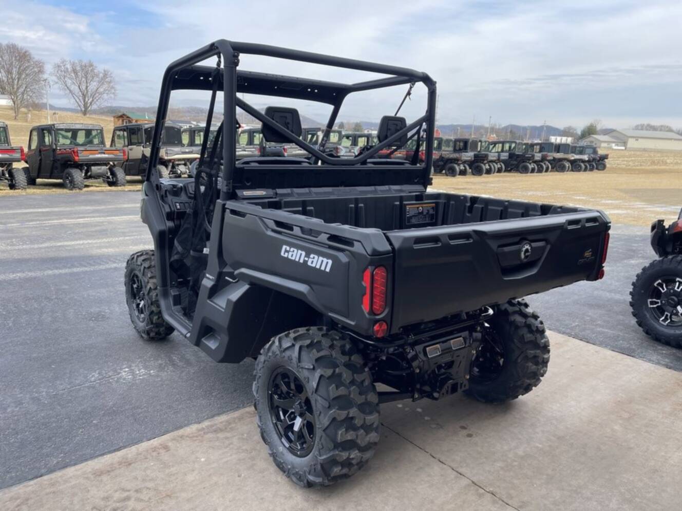 A photo of this 2026 Can-Am Defender DPS HD7 Compass Green