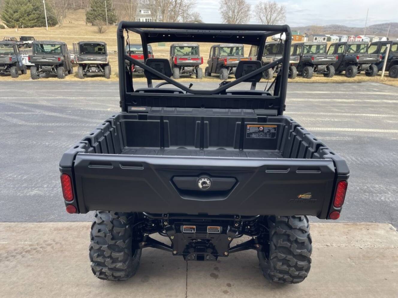 A photo of this 2026 Can-Am Defender DPS HD7 Compass Green