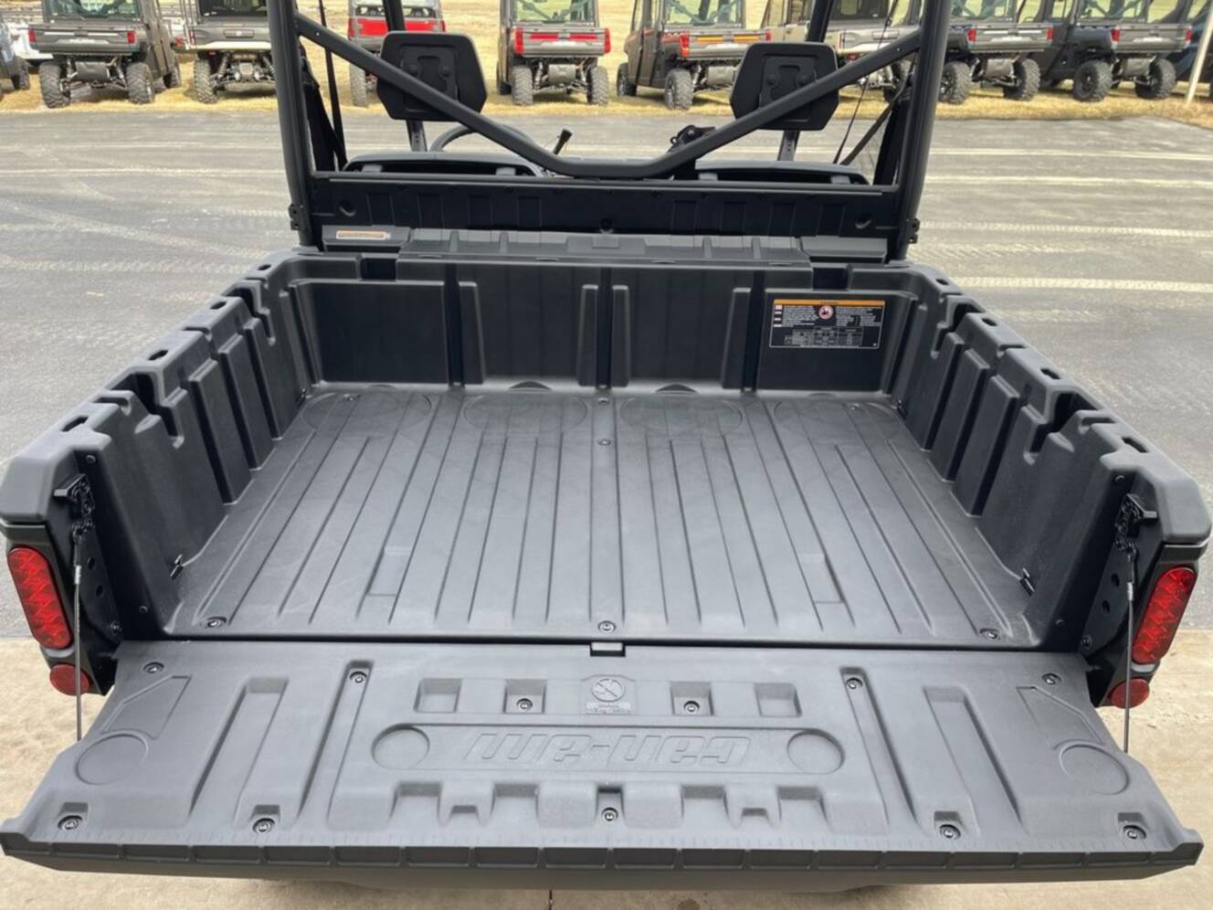 A photo of this 2026 Can-Am Defender DPS HD7 Compass Green