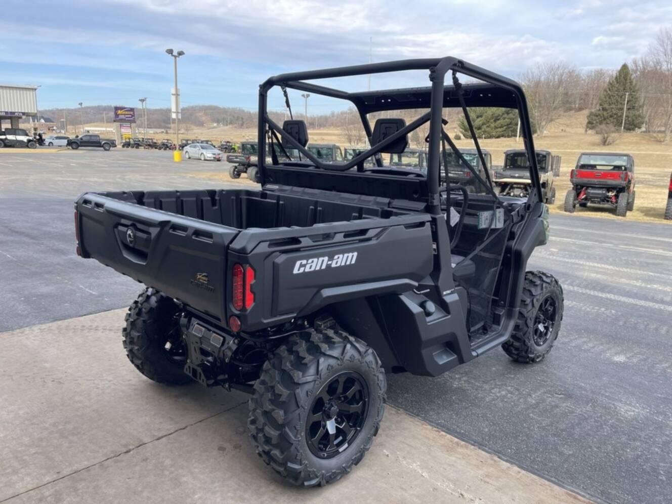A photo of this 2026 Can-Am Defender DPS HD7 Compass Green