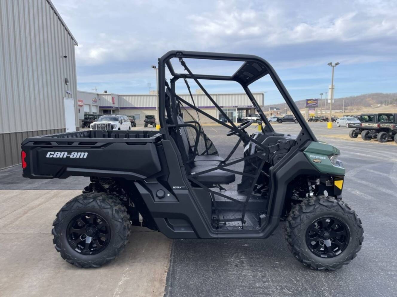A photo of this 2026 Can-Am Defender DPS HD7 Compass Green