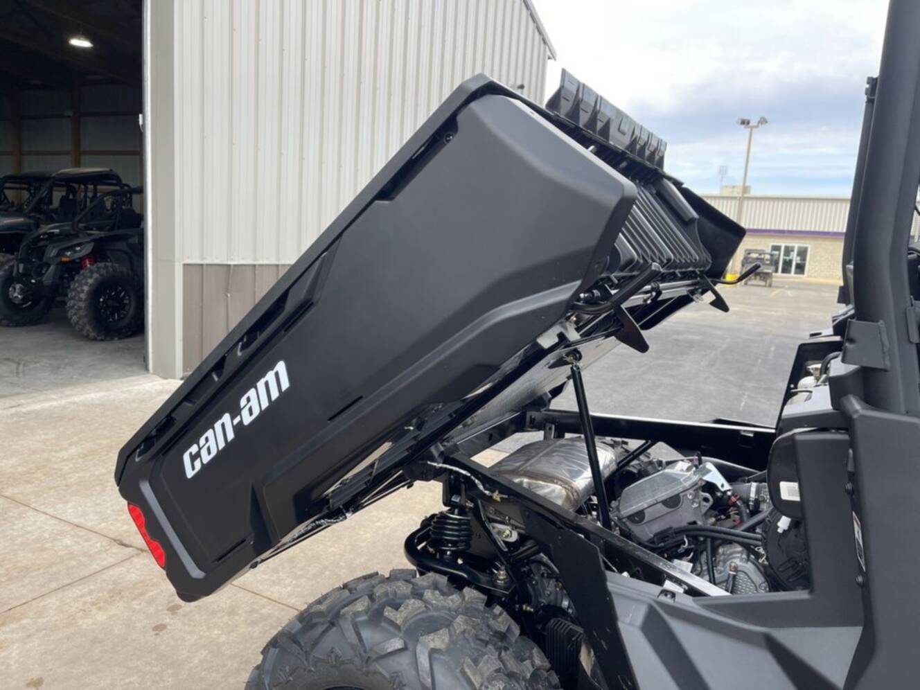 A photo of this 2026 Can-Am Defender DPS HD7 Compass Green