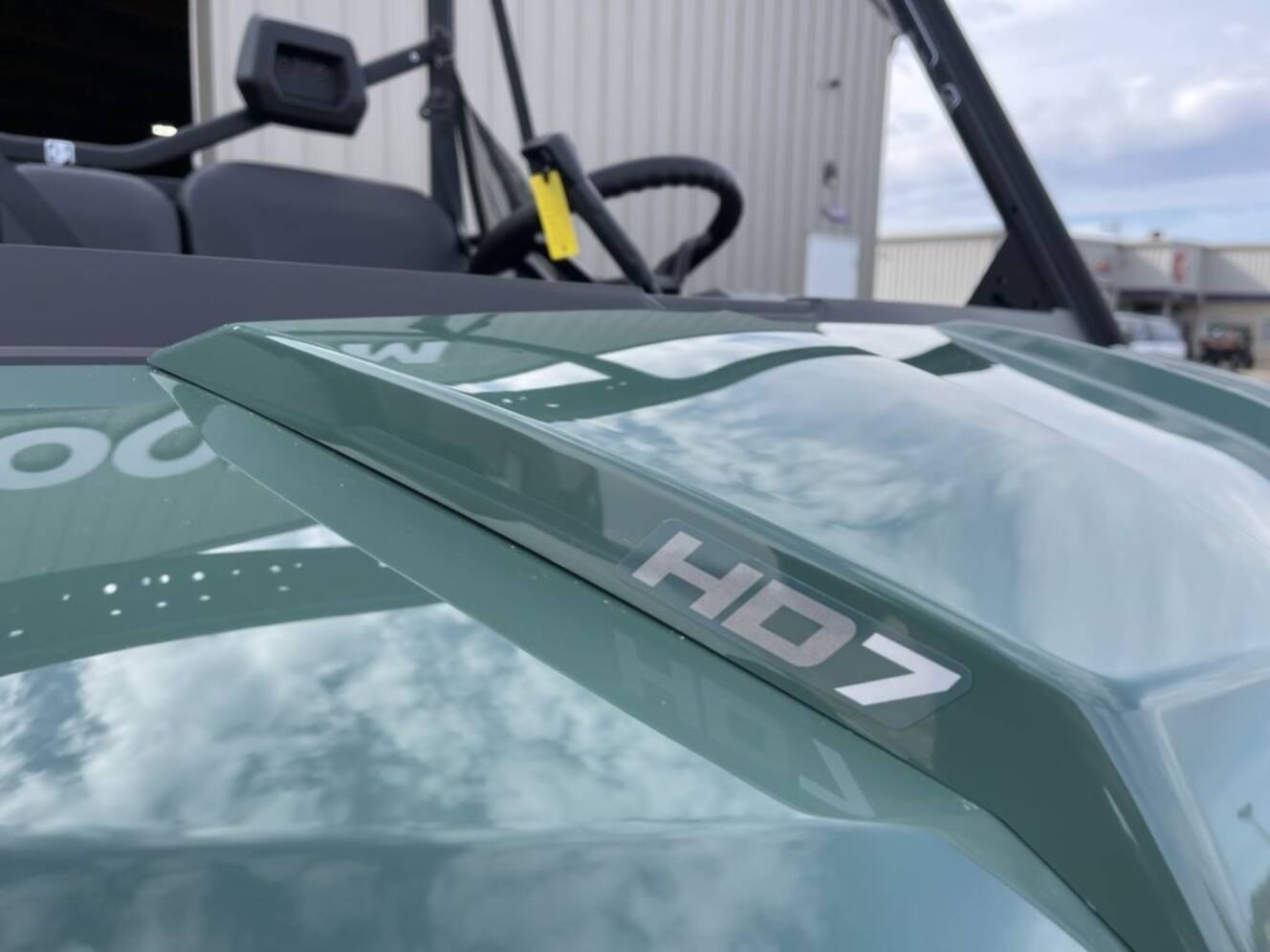 A photo of this 2026 Can-Am Defender DPS HD7 Compass Green